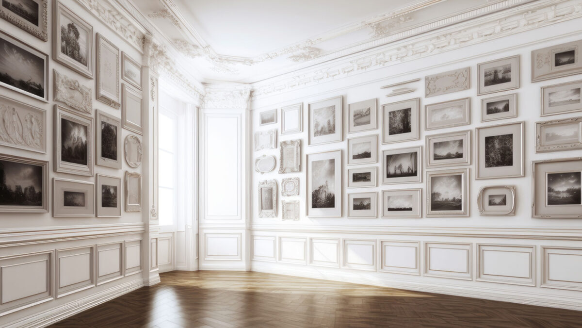 The corner of a white room, empty except for a gallery of images